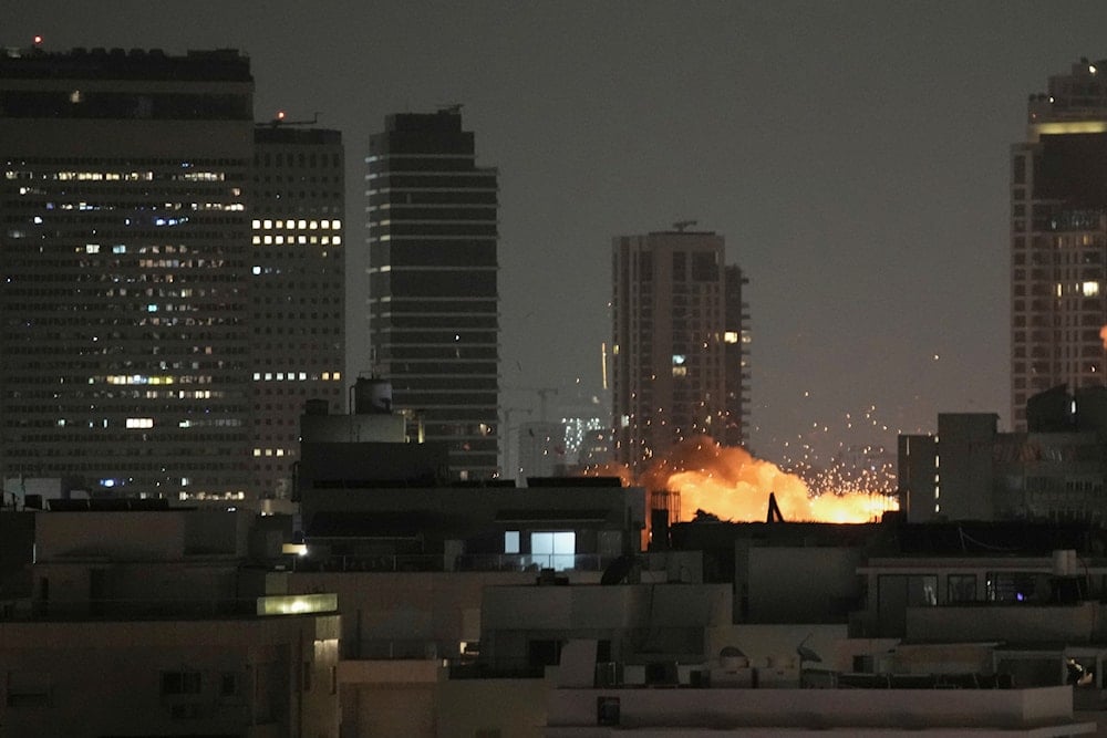 An explosion is seen during a missile attack in Tel Aviv, Israel, Sunday, June 15, 2025. (AP )