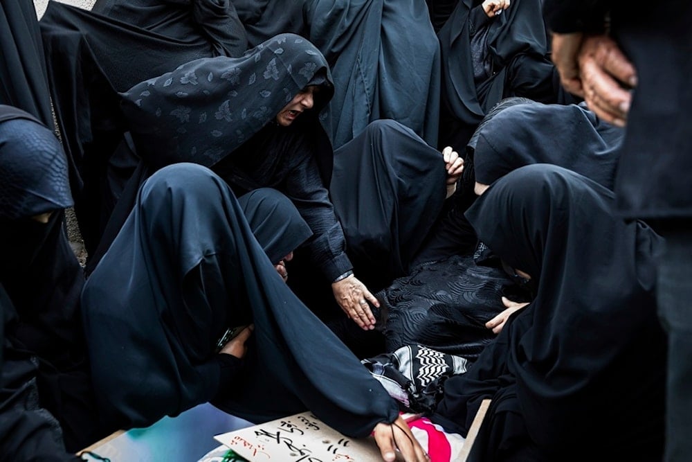 Women mourn over the body of Mohammadi Javad Naseri, who was reportedly killed in Israeli strikes in the northwestern Iranian city of Tabriz, Monday, June 16, 2025. (AP Photo/Matin Hashemi)