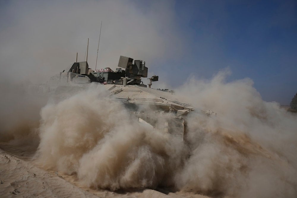 An Israeli occupation forces armored personnel carrier maneuvers in the Gaza Strip, southern occupied Palestine, Wednesday, June 11, 2025 (AP)