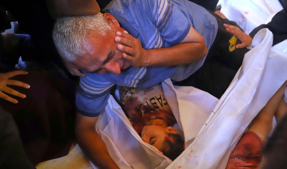 Palestinian relatives mourn over the body of a girl killed in an Israeli strike, at Nasser Hospital in Khan Younis, southern Gaza Strip, Tuesday, June 17, 2025. (AP)