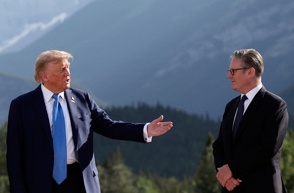 US President Donald Trump, left, and Britain's Prime Minister Keir Starmer attend a family photo session during the G7 Summit, in Kananaskis, Alberta, Monday, June 16, 2025 (AP)