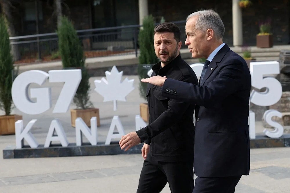 Canadian Prime Minister Mark Carney stands with Ukrainian President Volodymyr Zelenskiy during the G7 Leaders' Summit on June 17, 2025 in Kananaskis, Alberta (AP)