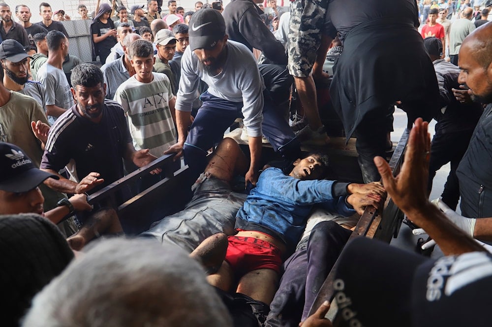 Palestinians injured in an Israeli strike are brought to Nasser Hospital in Khan Younis, southern Gaza Strip, on  June 17, 2025. (AP Photo/Mariam Dagga)