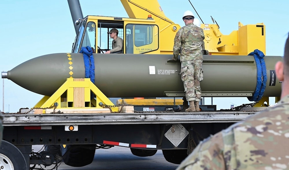 In this photo released by the U.S. Air Force on May 2, 2023, airmen look at a GBU-57, or the Massive Ordnance Penetrator bomb, at Whiteman Air Base in Missouri.(U.S. Air Force via AP, File)
