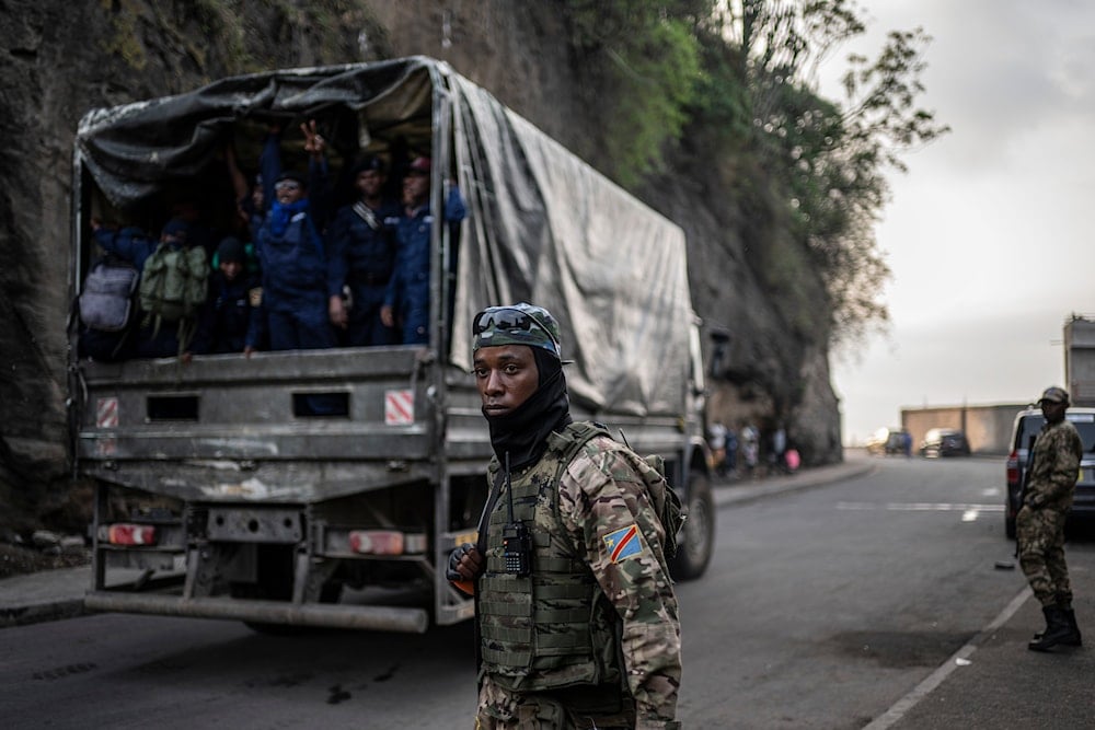 Former members of the Armed Forces of the Democratic Republic of Congo (FARDC) and police officers who allegedly surrendered to M23 rebels arrive in Goma, Congo, on February 23, 2025. (AP Photo/Moses Sawasawa)