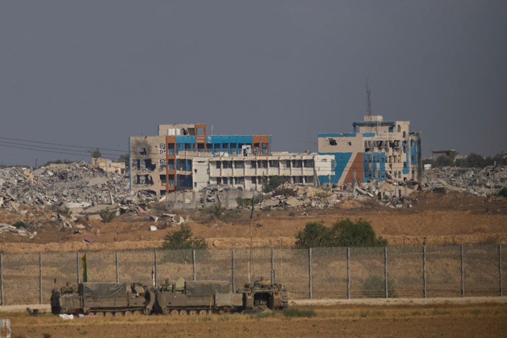 Israeli army vehicles are seen at a staging area near the border with the Gaza Strip, Occupied Palestine, Sunday, June 1, 2025 (AP)