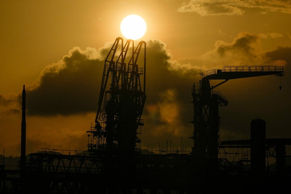 The sun sets over a liquefied natural gas power plant in Santa Clara, Batangas province, Philippines on Tuesday, Aug. 8, 2023 (AP)