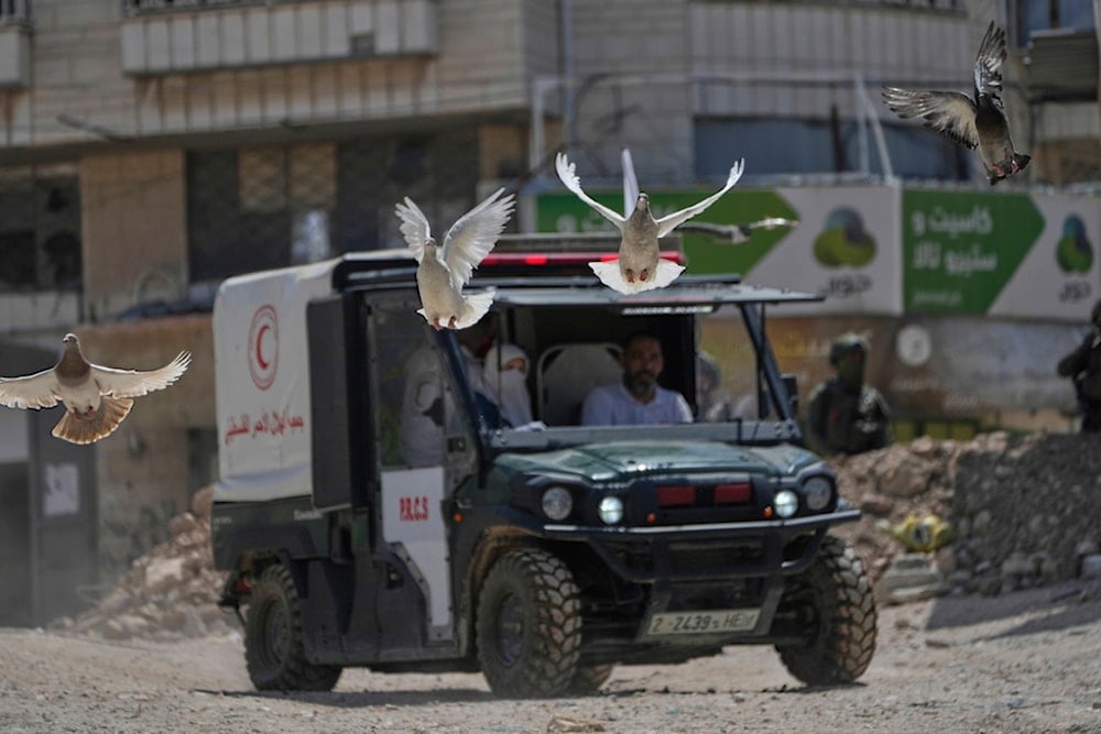 A Palestinian Red Crescent vehicle evacuates residents of the Tulkarm refugee camp who returned to collect belongings before the destruction of their homes in the Israeli-occupied West Bank city of Tulkarm, Thursday, May 29, 2025 (AP)