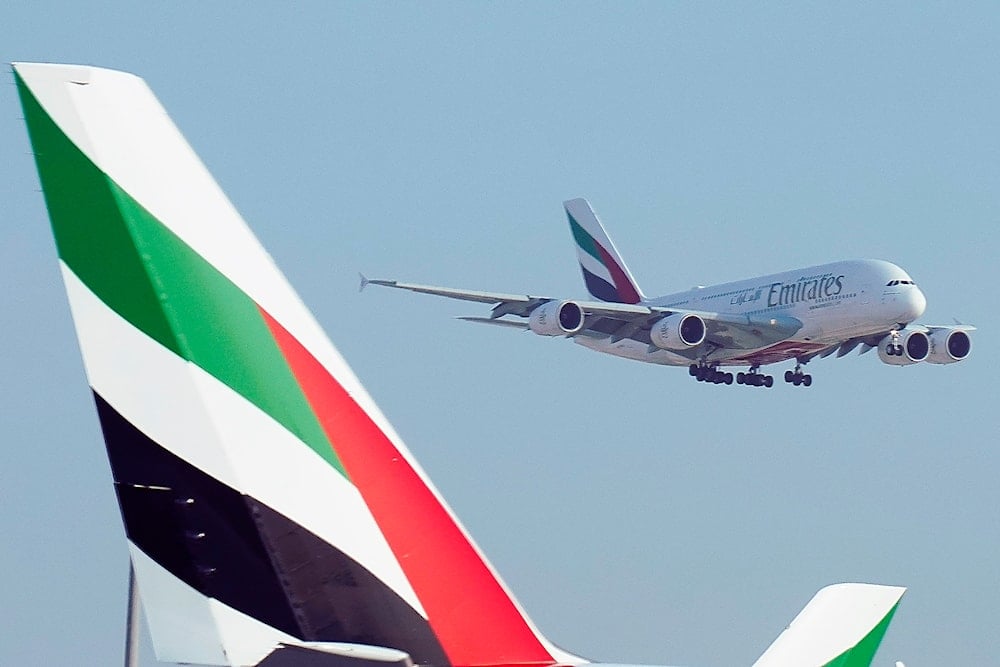 An Emirates Airbus A380 jumbo jet lands at Dubai International Airport in Dubai, United Arab Emirates, Friday, Sept. 9, 2022 (AP)