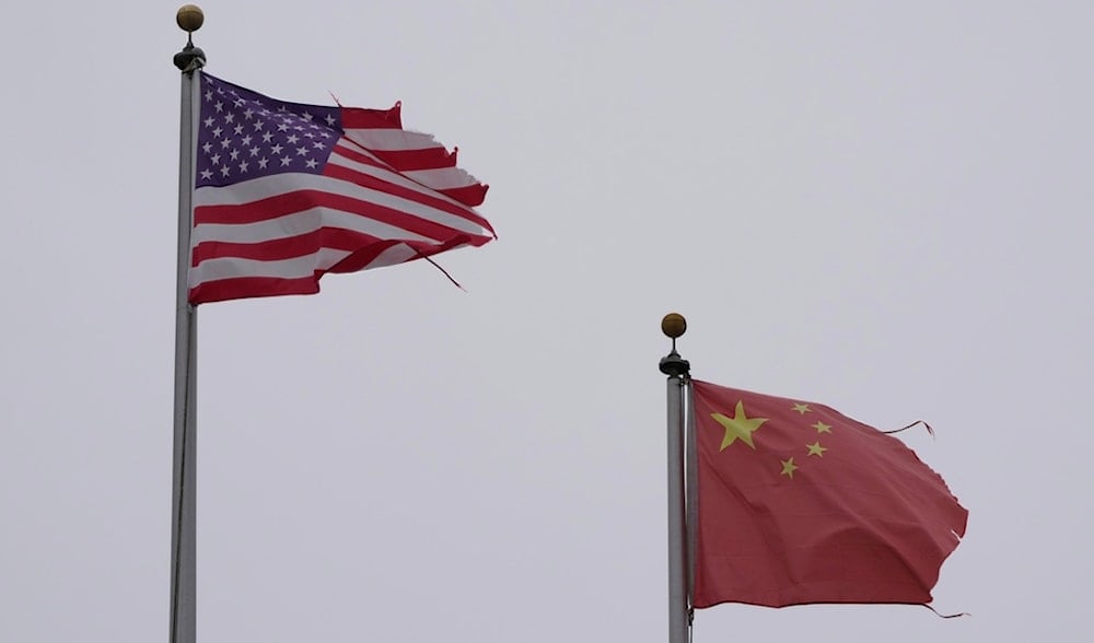A flag of the United States flies next to a flag of China in Chinatown in San Francisco, Friday, April 18, 2025. (AP)