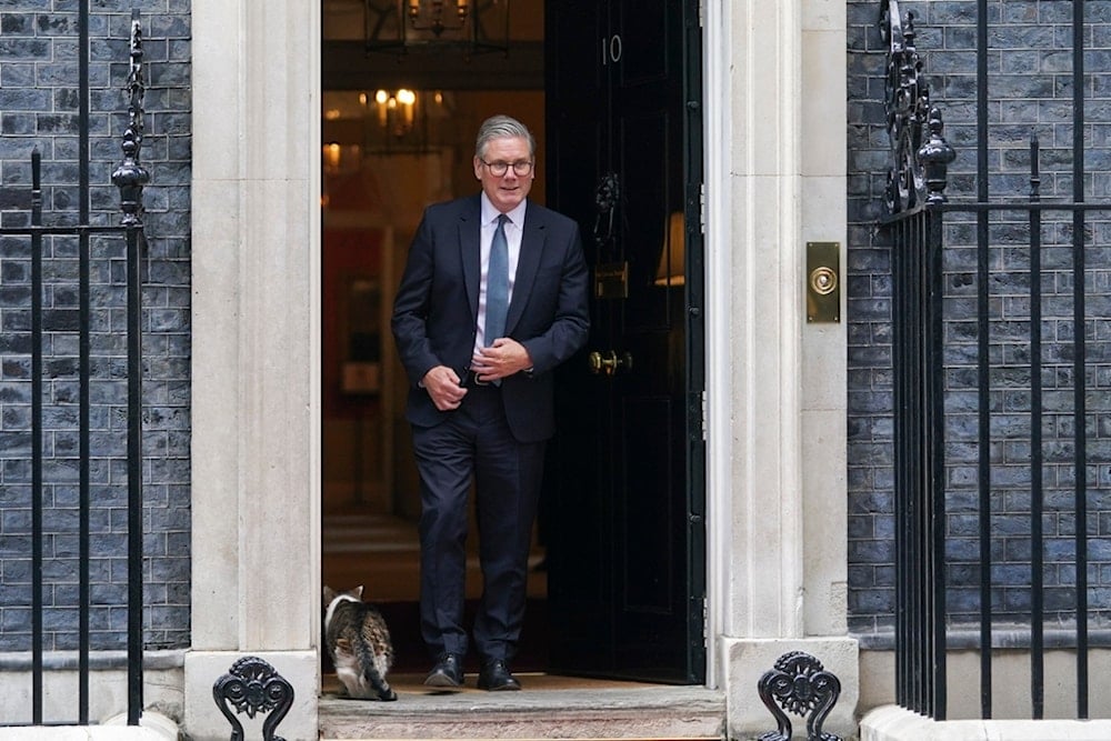 Britain's Prime Minister Keir Starmer steps out of 10 Downing Street to greet Cyprus' President Nikos Christodoulides, in London, Wednesday, May 21, 2025 (AP)