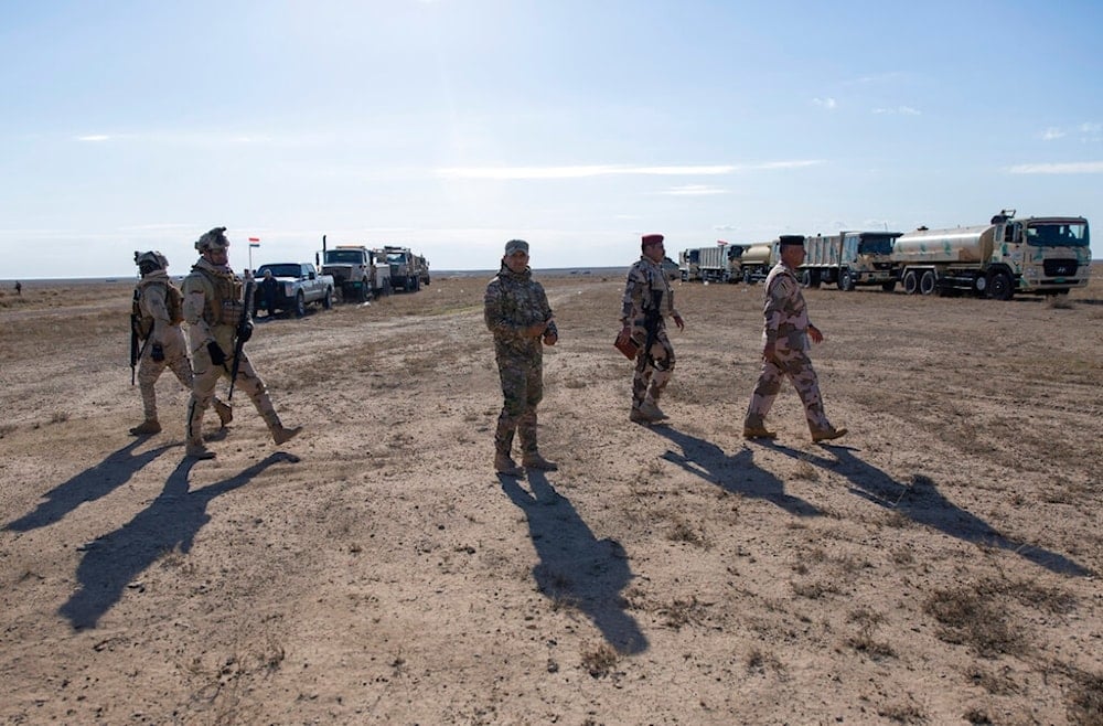 Army commanders tour the operations sectors of the Iraqi army Seventh Brigade, in Anbar, Iraq, Sunday, December 29, 2019 (AP)