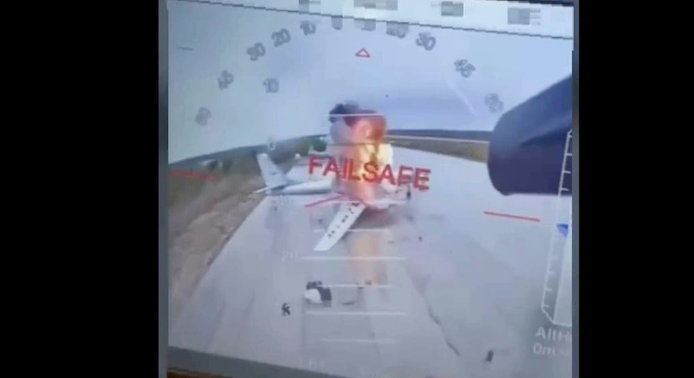 In this image taken from video released June 1, 2025, by a source in the Ukrainian Security Service shows a Ukrainian drone striking Russian planes deep in Russia's territory (AP)