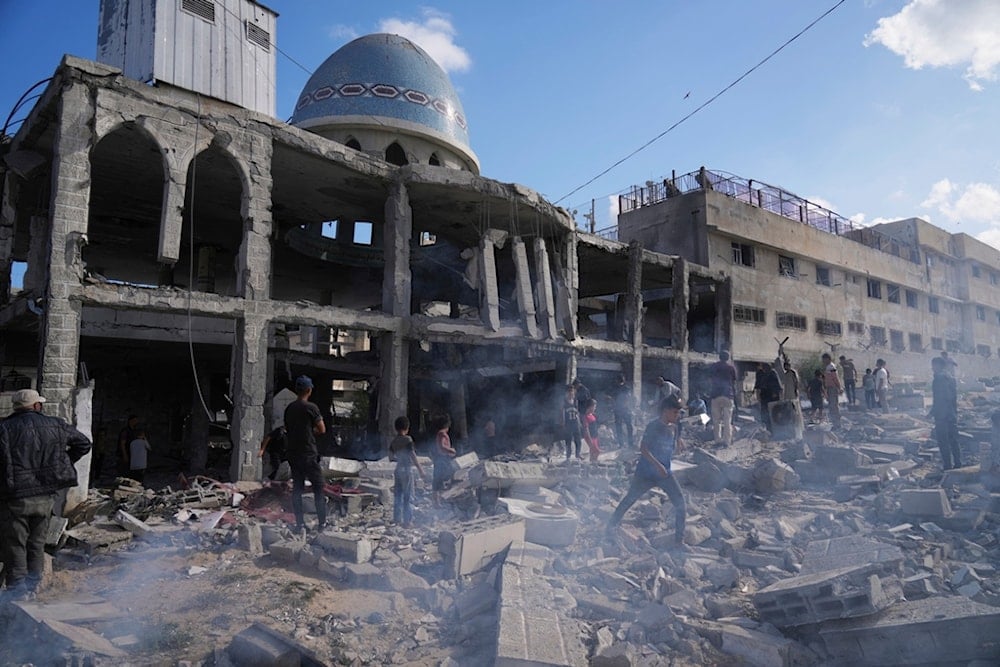 Palestinians inspect the rubble at the Al-Ansar Mosque following an Israeli strike in Deir al-Balah, Gaza Strip, Monday, June 2, 2025 (AP)