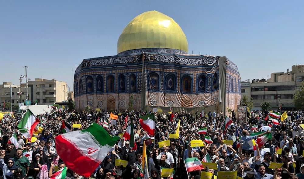 Iranian worshippers wave Iranian flags during a protest against Israeli attacks on multiple cities across Iran, after the Friday prayers at Revolution Square in Tehran, Iran, Friday, June 20, 2025. (AP)