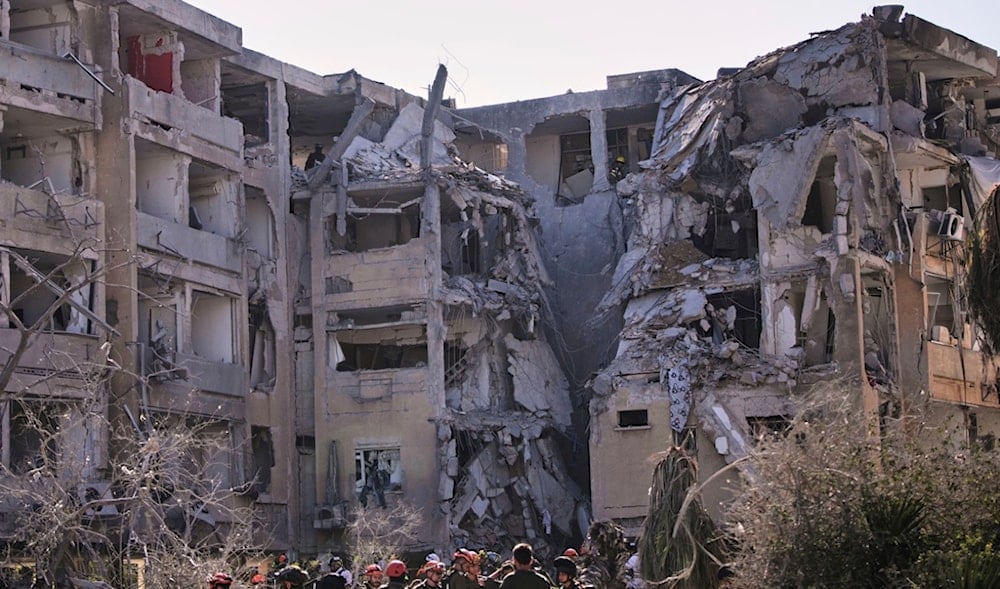 Israeli security forces inspect a destroyed building that were hit by a missile fired from Iran, in Holon, near Tel Aviv, Thursday, June 19, 2025. (AP)
