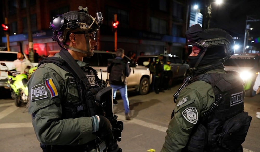 Police stand guard outside the Medicentro hospital where Colombian senator and presidential candidate Miguel Uribe Turbay is being treated after he was shot during a campaign rally in Bogota, Colombia, June 7, 2025. (AP)