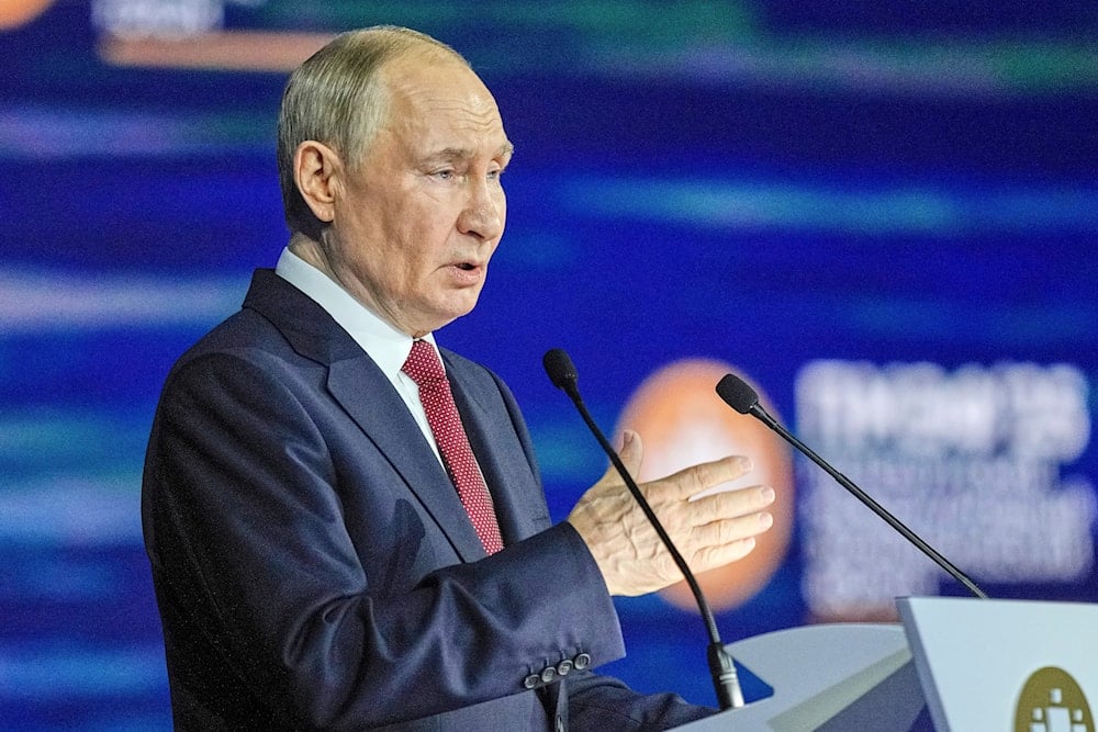 Russian President Vladimir Putin gestures as he addresses a plenary session of the St. Petersburg International Economic Forum in St. Petersburg, Russia, on Friday, June 20, 2025 (AP)