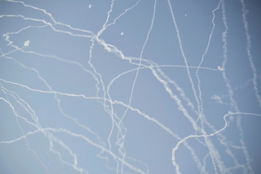 Israeli air defense system fires to intercept missiles during an Iranian attack over Tel Aviv, occupied Palestine, Thursday, June 19, 2025. (AP Photo/Leo Correa)
