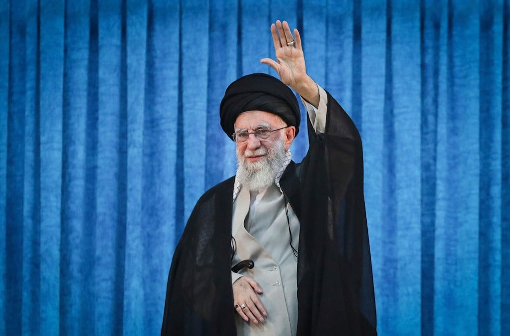 Iran's Leader Sayyed Ali Khamenei waves as he arrives for a ceremony marking the anniversary of the death of the late leader Sayyed Ruhollah Khomeini at his shrine just outside Tehran, Iran, Wednesday, June 4, 2025 (AP)
