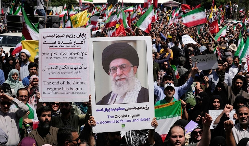 Iranian protestors carry portrait of Leader Sayyed Ali Khamenei and anti-Israeli signs during a protest to condemn Israeli attacks on multiple cities across Iran, June 20, 2025. (AP)