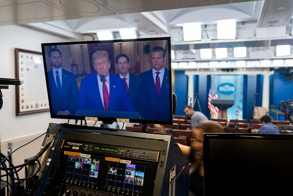 US President Donald Trump speaks from the East Room of the White House as seen on a television monitor in the James Brady Press Briefing Room, in Washington, after the U.S. military struck three sites in Iran. (AP)