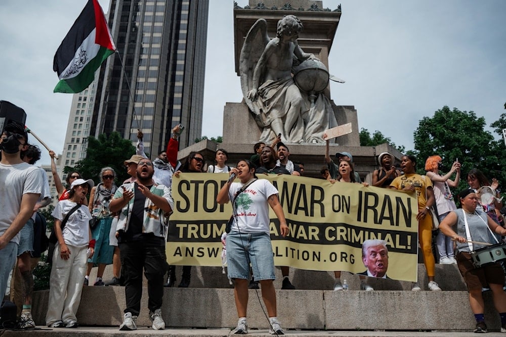People shout slogans during a protest against US strikes on Iran, Sunday, June 22, 2025, in New York (AP)