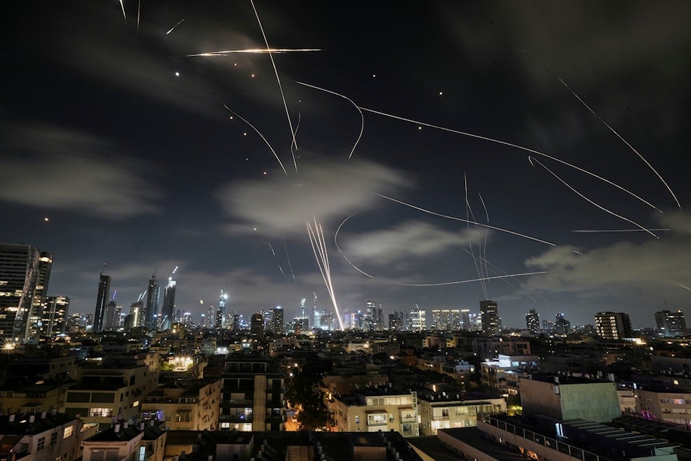 The Israeli Iron Dome air defense system fires to intercept missiles during an Iranian attack over Tel Aviv, early Wednesday, June 18, 2025. (AP)