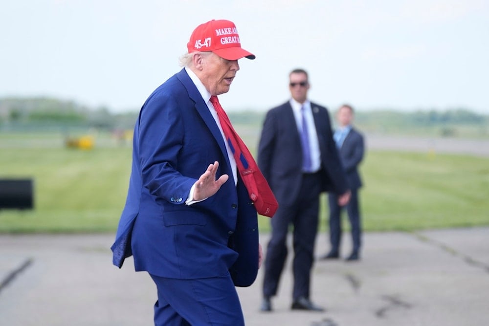 President Donald Trump boards Air Force One at Morristown Municipal Airport in Morristown, N.J., Saturday, June 21, 2025. (AP Photo/Manuel Balce Ceneta)