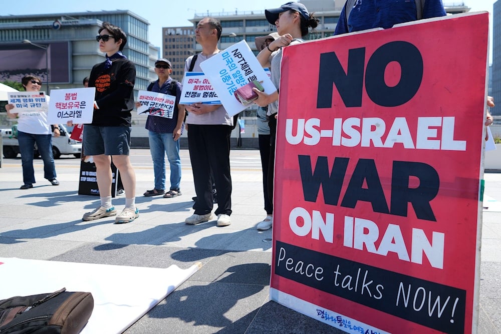 Members of civic groups arrive for a press conference condemning the U.S. military strikes against Iran near the US embassy in Seoul, South Korea, Monday, June 23, 2025. (AP Photo/Lee Jin-man)
