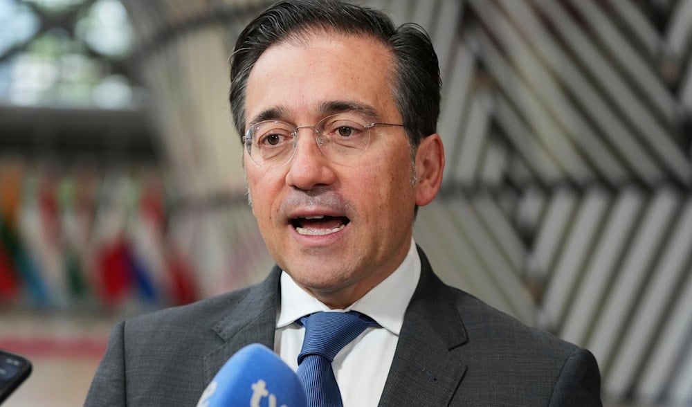 Spain's Foreign Minister Jose Manuel Albares Bueno speaks with the media as he arrives for a meeting of EU foreign ministers at the European Council building in Brussels, Monday, June 23, 2025. (AP Photo/Virginia Mayo)