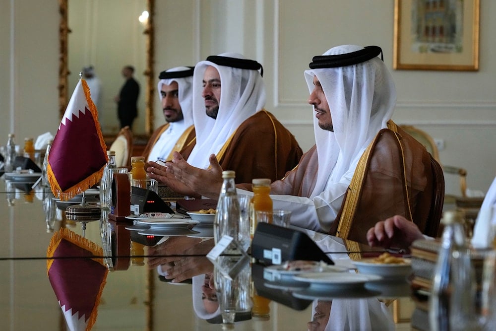 Qatari Prime Minister and Foreign Minister Sheikh Mohammed bin Abdulrahman Al Thani, right, speaks with Iranian Foreign Minister Abbas Araghchi during their meeting in Tehran, Iran, Monday, Aug. 26, 2024. (AP)