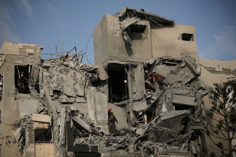 Israeli security forces inspect the site struck by an Iranian missile strike that killed several people, in Beer al-Sabe', Occupied Palestine, on Tuesday, June 24, 2025 (AP)