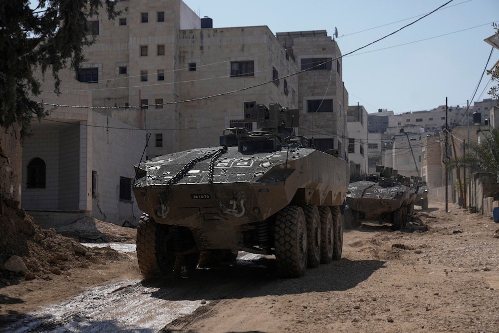 Israeli army vehicles are seen during an invasion in the West Bank city of Jenin, Tuesday, March 11, 2025