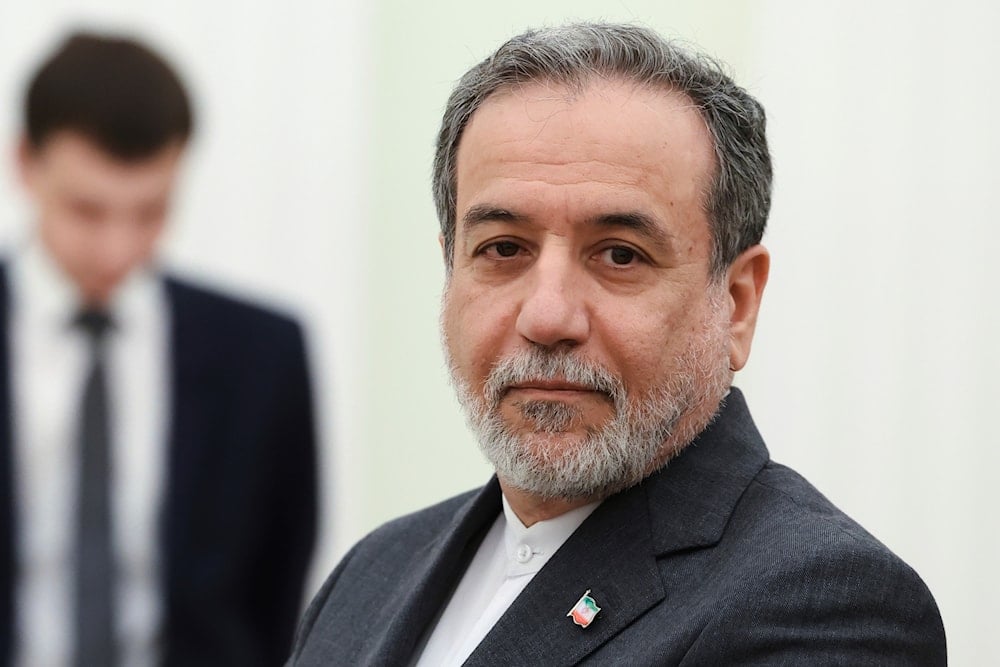 Iranian Foreign Minister Abbas Araghchi stands waiting to meet Russian President Vladimir Putin for the talks at the Kremlin in Moscow, Russia, Monday, June 23, 2025. (Alexander Kazakov, Sputnik, Kremlin Pool Photo via AP)