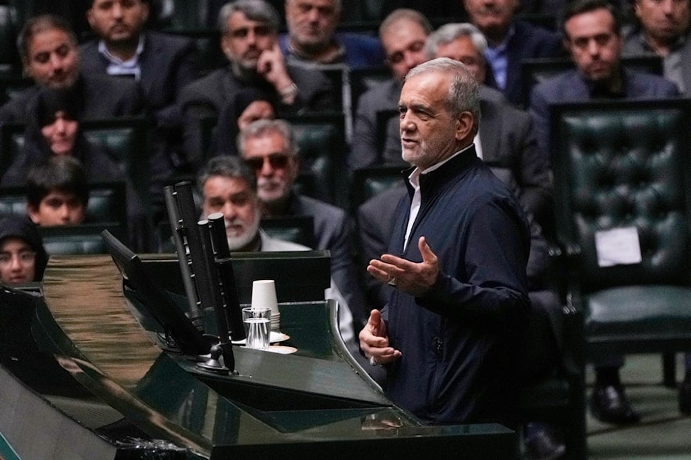 Iranian President Masoud Pezeshkian speaks during a memorial at the parliament in Tehran, Iran, Wednesday, May 21, 2025 (AP)
