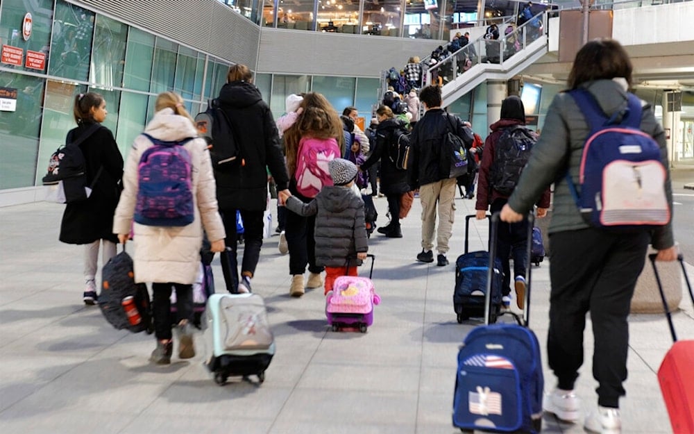 Ukrainian orphans are seen during a stopover in Warsaw as they are en route to the UK, in Warsaw, Poland, on Monday March 21, 2022. (AP)