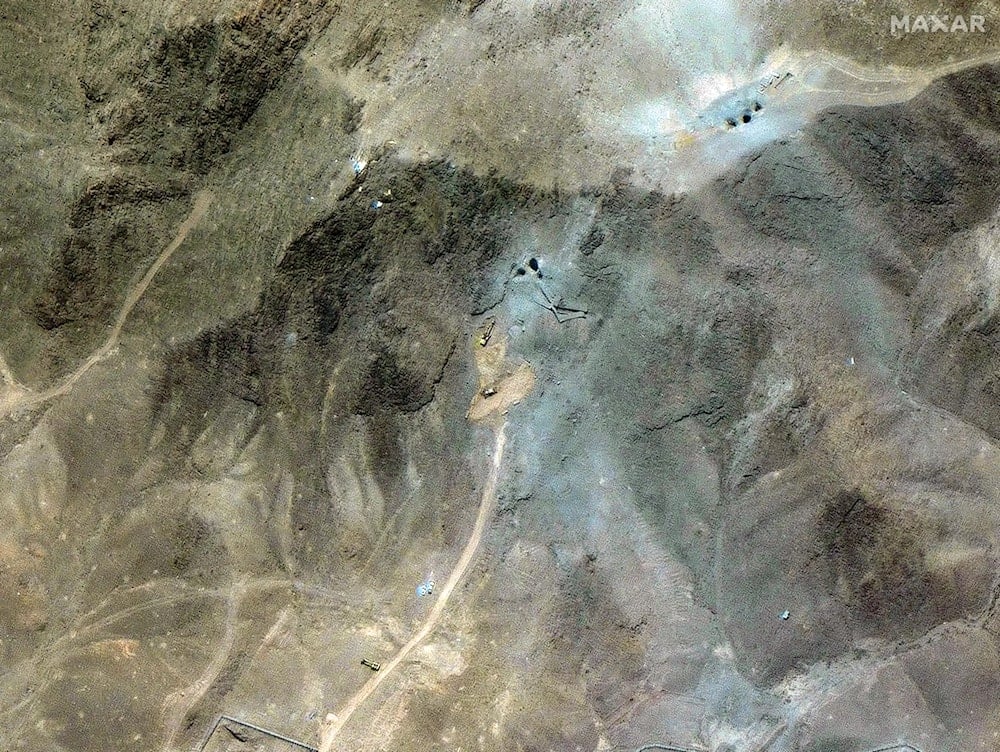 Excavators appear to be repairing access to Iran's underground facility at Fordow. Satellite image ©2025 Maxar Technologies