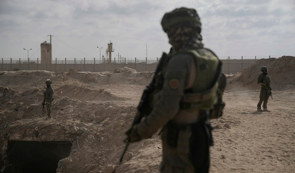 Israeli soldiers take up positions in the southern Gaza Strip, about 100 meters from the Philadelphi Corridor along the border with Egypt, during a ground assault on Friday, Sept. 13, 2024. (AP)