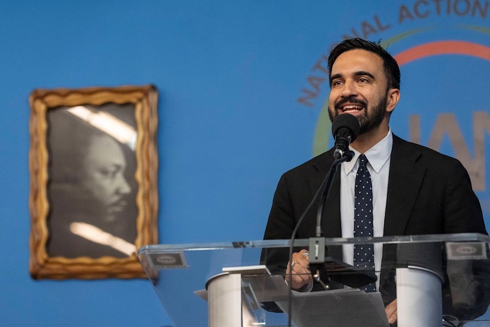 Democratic mayoral candidate Zohran Mamdani speaks next to a portrait of Martin Luther King Jr. during the National Action Network's Saturday action rally at House of Justice in Harlem, Saturday, June 28, 2025, in New York. (AP)