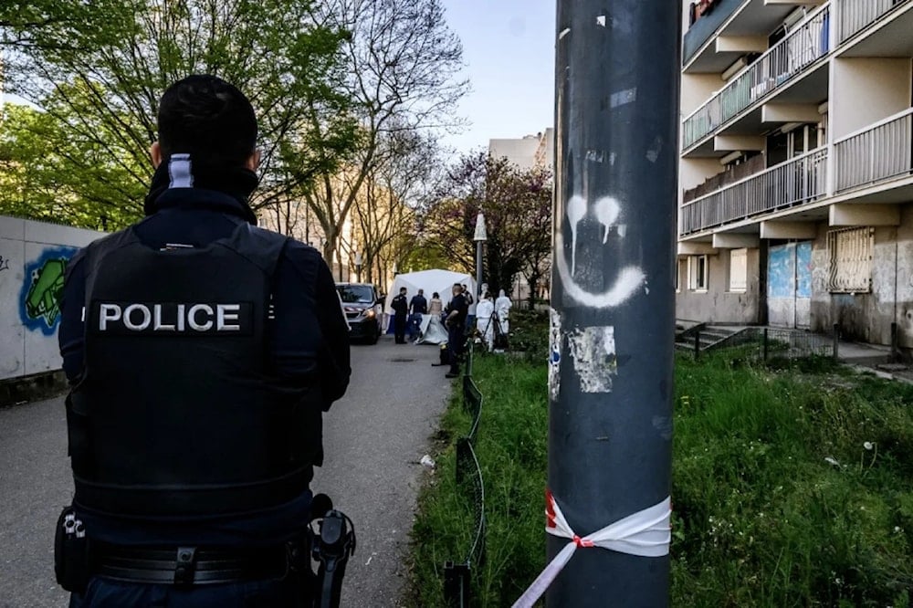 A French Police member stands at the crime scene where a French man murdered his Tunisian neighbor, southeastern France, June, 2, 2025 (AFP)