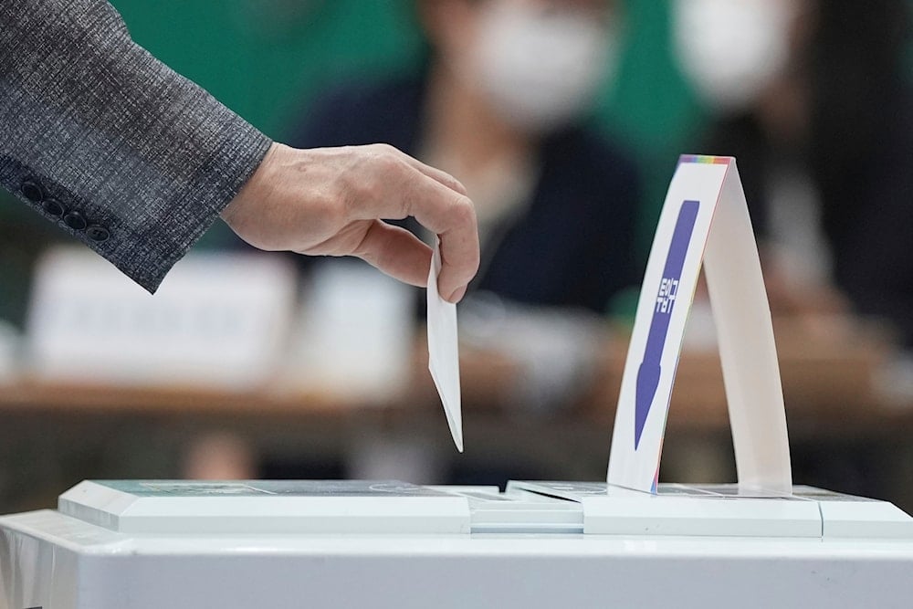 A man casts his vote for the presidential election at a polling station in Seoul, South Korea, Tuesday, June 3, 2025 (AP)