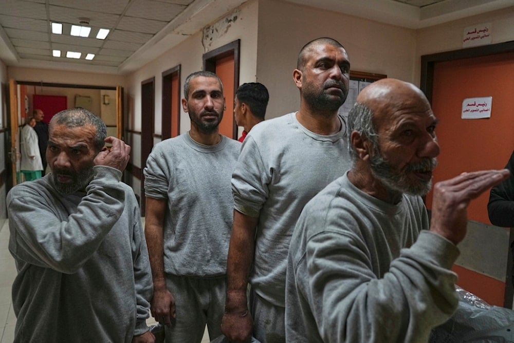 Freed Palestinian prisoners upon arrival at al-Aqsa Hospital in Deir al-Balah, central Gaza Strip, after being released from an Israeli prison, Thursday, April 10, 2025 (AP)