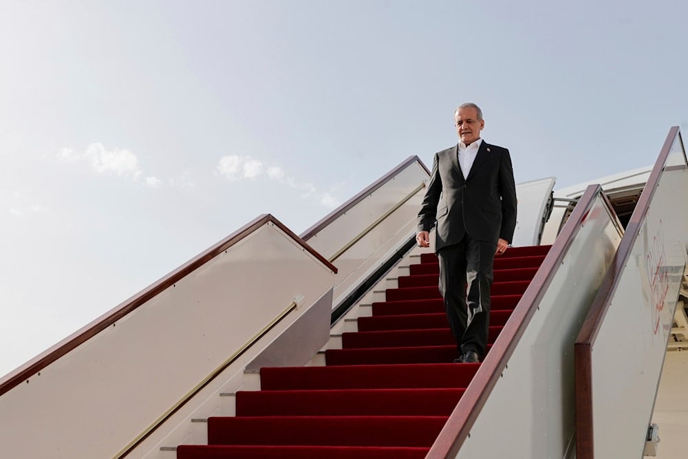 In this photo released by the Iranian Presidency Office, President Masoud Pezeshkian steps out from his plane as he arrives at Muscat, Oman, on May 27, 2025. (Iranian Presidency Office via AP)