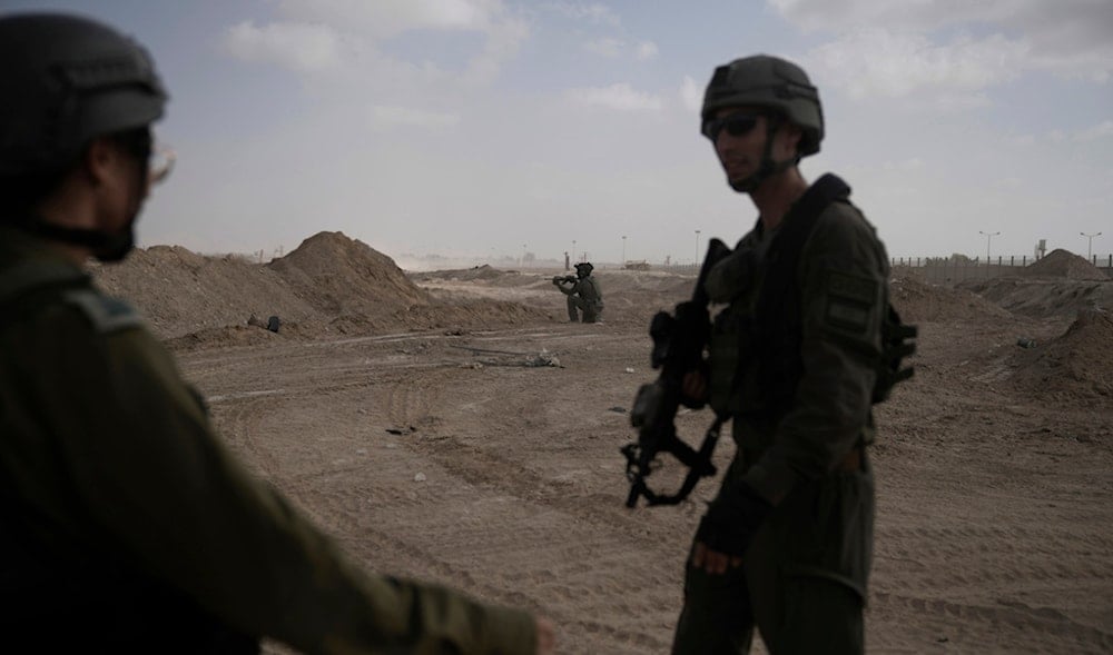  Israeli soldiers next to the Philadelphi Corridor along the border with Egypt, in the Gaza Strip, Sept. 13, 2024. (AP)