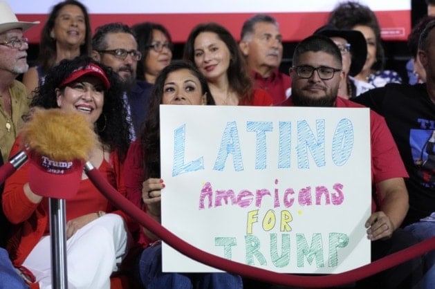 Supporters hold a sign before campaign event for Donald Trump on Sept.12, 2024, in Tucson, Ariz. (Alex Brandon/AP)