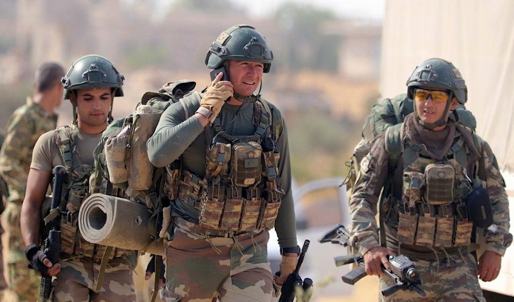 Turkish troops deploy in Syria's northern region of Manbij, Syria, Oct. 14, 2019. (AP)