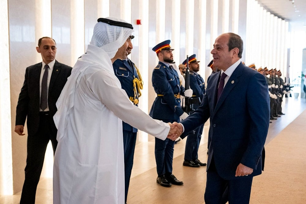 President Abdel Fattah El-Sisi and Sheikh Mohammed bin Zayed Al Nahyan shake hands in Abu Dhabi. (Agencies)