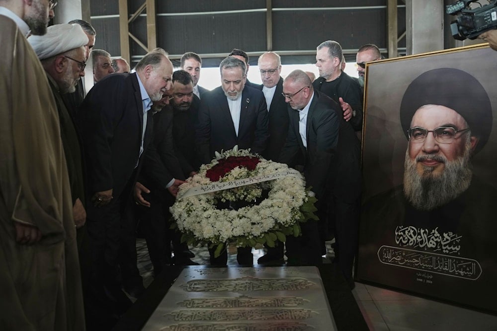 Iranian Foreign Minister Abbas Araghchi, center, lays a wreath at the shrine of martyr Sayyed Hassan Nasrallah in the southern suburbs of Beirut, Lebanon, Tuesday, June 3, 2025. (AP)