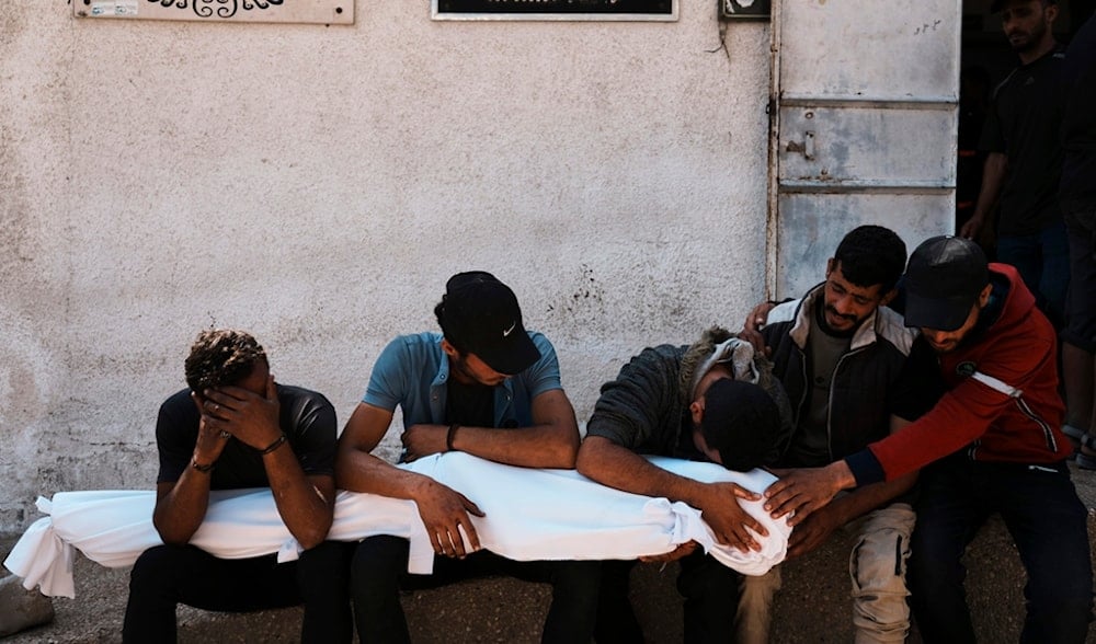Palestinians mourn over the bodies of their relatives who were killed in an Israeli strike on Gaza, Gaza City, June 4, 2025. (AP)